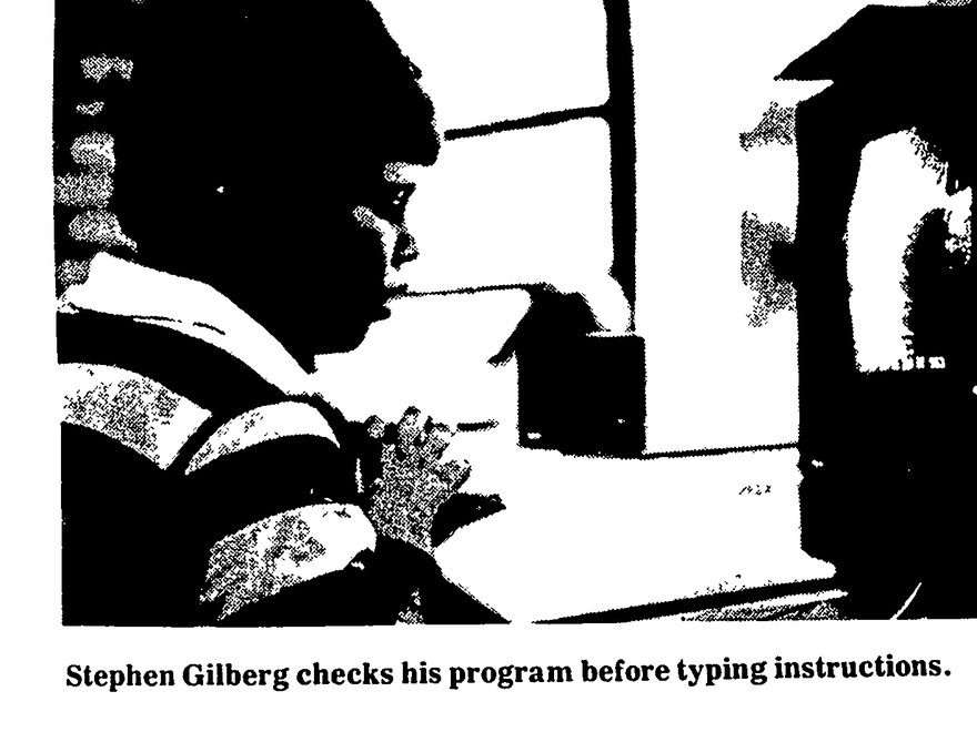 Stephen Gilberg checks his program before typing instructions.